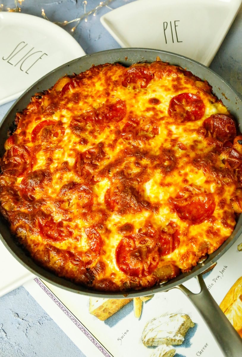 Switch to the broil setting for 3-minutes and bake until the cheese is crispy golden brown. Don't over broil! Serve immediately while the cheese pull is at peak drama!