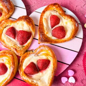 Homemade heart shaped strawberry cream cheese danish recipe with puff pastry