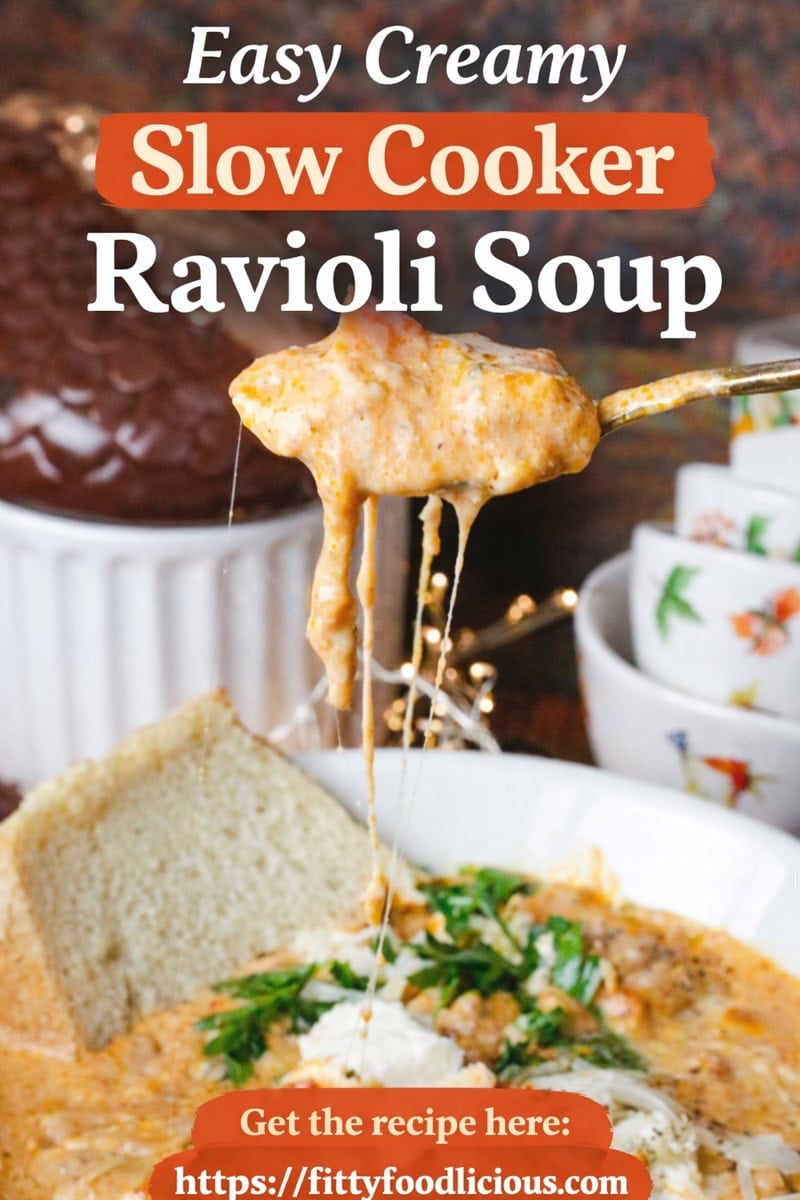 Creamy slow cooker ravioli soup with ground beef, cheese, and tomato broth in a white bowl with crusty bread – easy crockpot ravioli soup recipe.