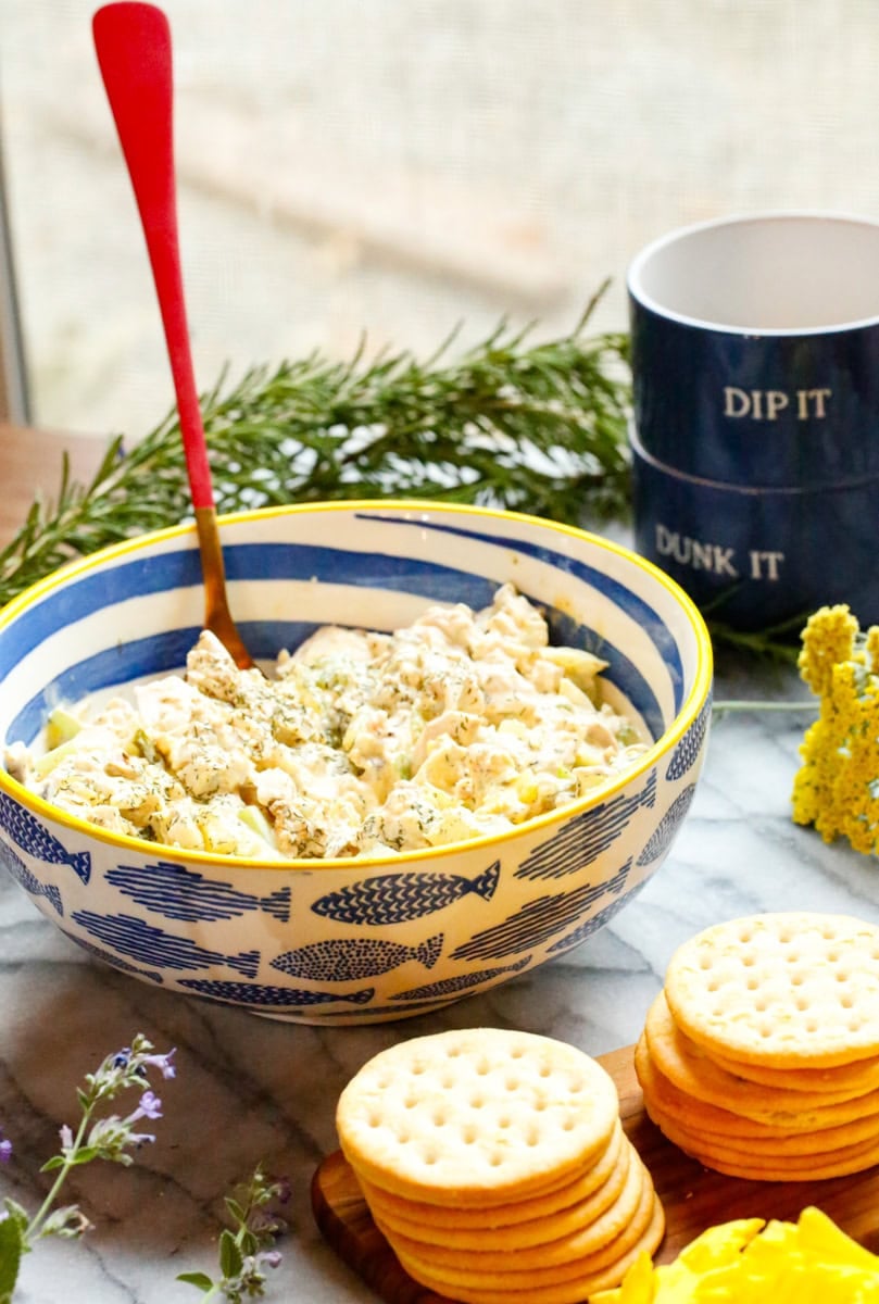 Creamy dill pickle chicken salad served in a blue fish-pattern bowl.