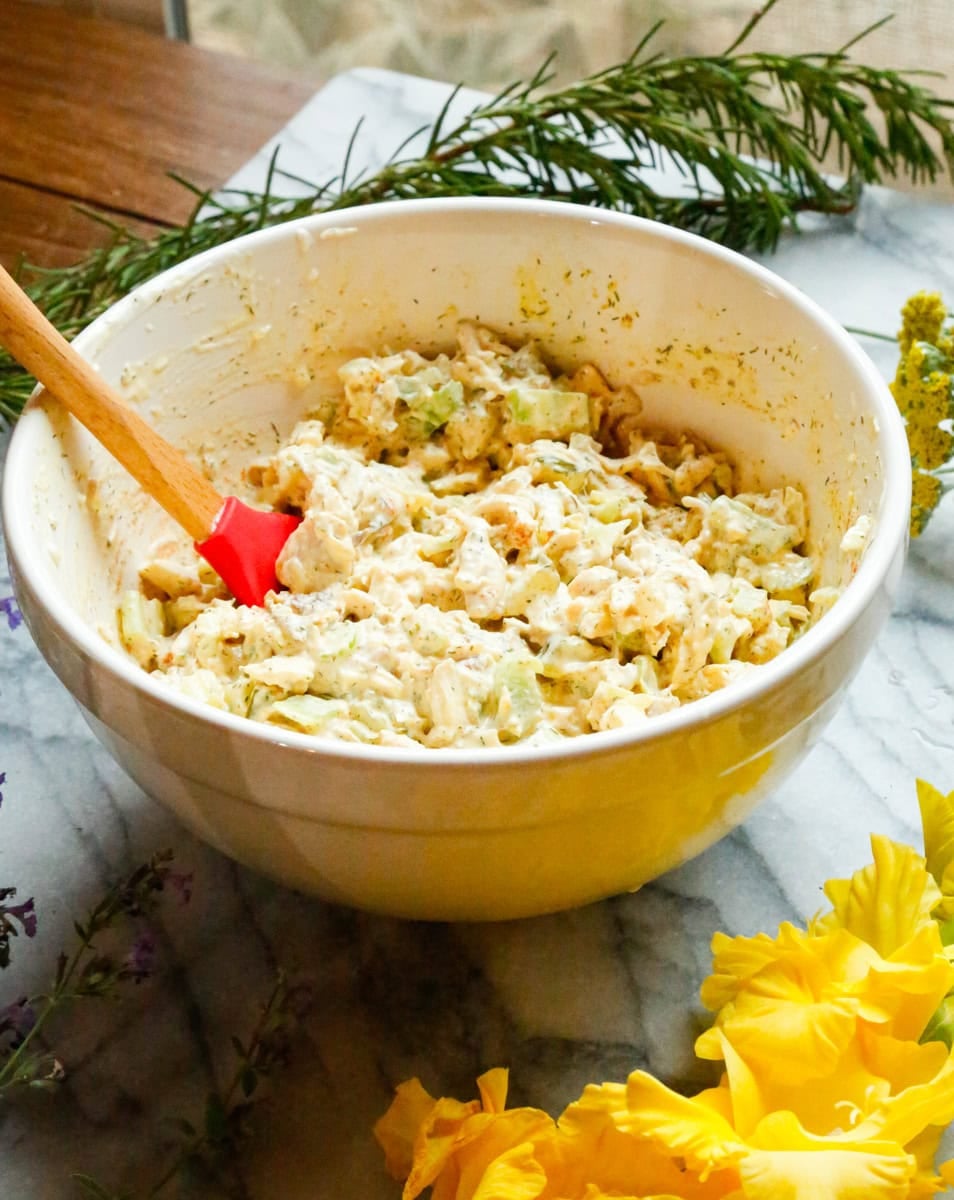 Creamy dill pickle chicken salad mixed together in a large bowl.
