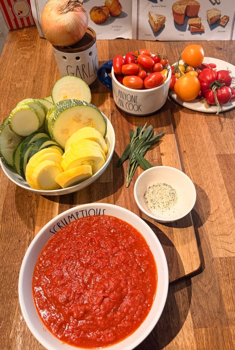 Grey striped squash, eight ball zucchini, cherry tomatoes , yellow squash, and seasonings
