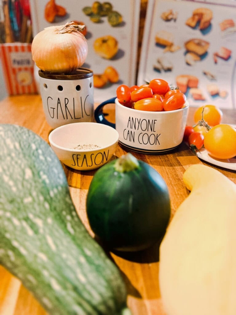 Grey striped squash, eight ball zucchini, cherry tomatoes , yellow squash, and seasonings