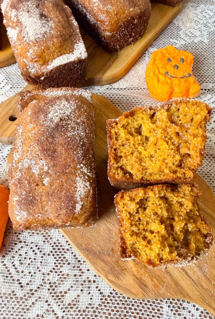 These Mini Loaves Pumpkin Bread are soft, moist, and bursting with warm pumpkin spice flavor! Made with pumpkin puree and sweetened condensed milk, these adorable mini pumpkin bread loaves have a tender crumb and a delicious cinnamon sugar crust. This easy pumpkin bread recipe is perfect for autumn mornings with a hot cup of coffee. Each mini loaf is perfectly portioned, making these homemade pumpkin treats a delicious breakfast, afternoon snack, or sweet dessert.